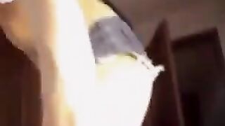 A blonde Russian with big natural boobs plays with them on camera