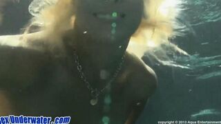 Blonde beauty gives a blowjob while swimming in the pool