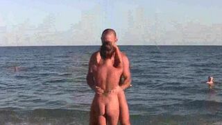 A naked beauty does acrobatics on the beach, showcasing flexibility