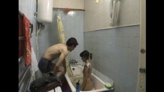A brother is shooting his stepsister in the bathroom without her knowledge
