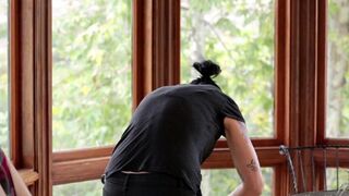 Sexy Vietnamese girl in the kitchen with a strap-on