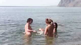 A hot chick is fucking on the naked beach