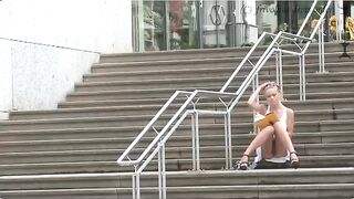 A girl walks down the street without panties, and a guy started to masturbate