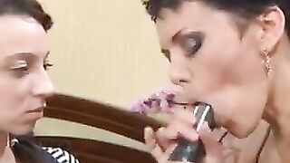 A mother introduces a Russian girl to the art of blowjob using a strap-on