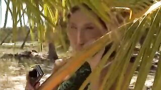 A couple has anal sex right on the sandy beach