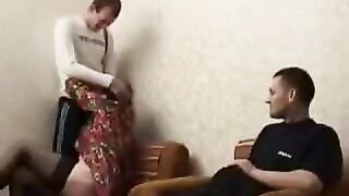 A drunken woman fucked with her son and his friend in stockings
