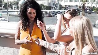 Girls are stripping on the strip, showing their bodies to passers-by