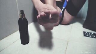 A girl washes herself in the shower and caresses herself