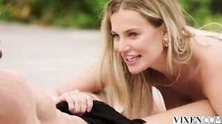 A charming girl is walking on the street and showing her assets