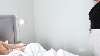 A cute girl bounces on a big mom’s bed