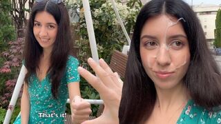 A girl is playing a game and got a little bit of dirt on her face