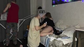 A petite girl has sex with her two friendly guys