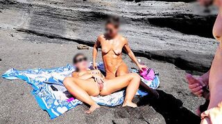 A spitting hot girl stripping on the nude beach and masturbating