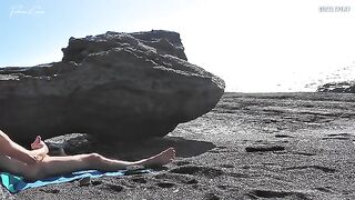 A spitting hot girl stripping on the nude beach and masturbating