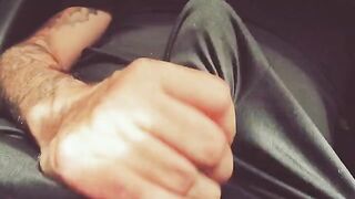 A guy masturbates his cock with his hand, moaning loudly and talking dirty