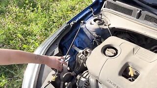 A fit girl fixed her car and called a young couple