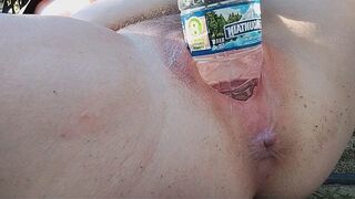 A girl reached the peak of pleasure while indulging with a water bottle