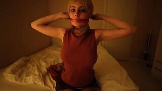A hot girl in a sexy cosplay suit plays with a big toy