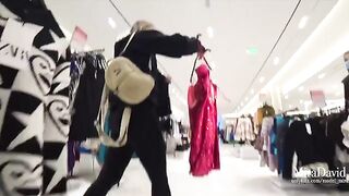 A girl almost gets caught while giving a blowjob in the fitting room